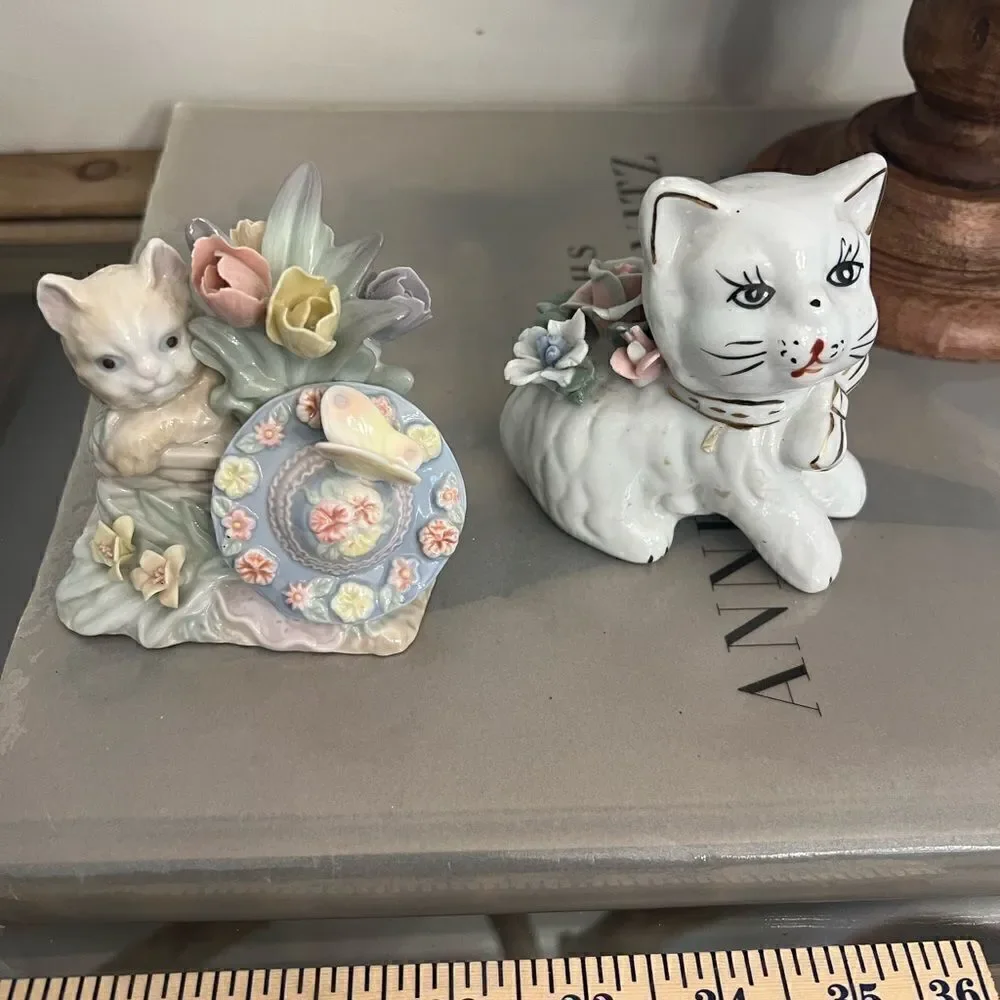 Set of two vintage small ceramic white and floral cats.